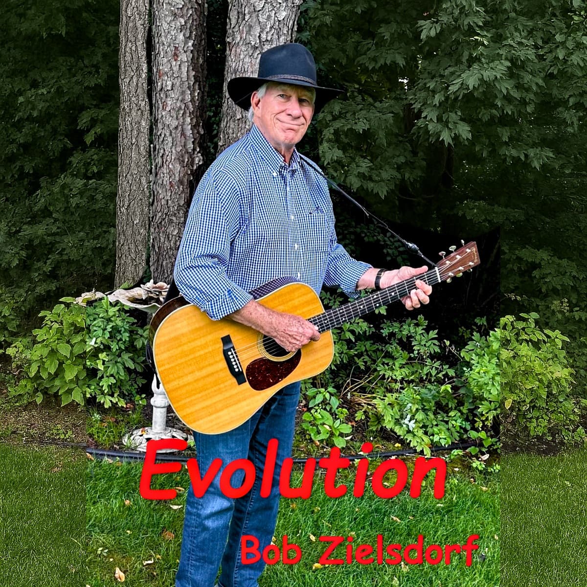 Bob Zielsdorf with his acoustic guitar, from the Evolution album cover